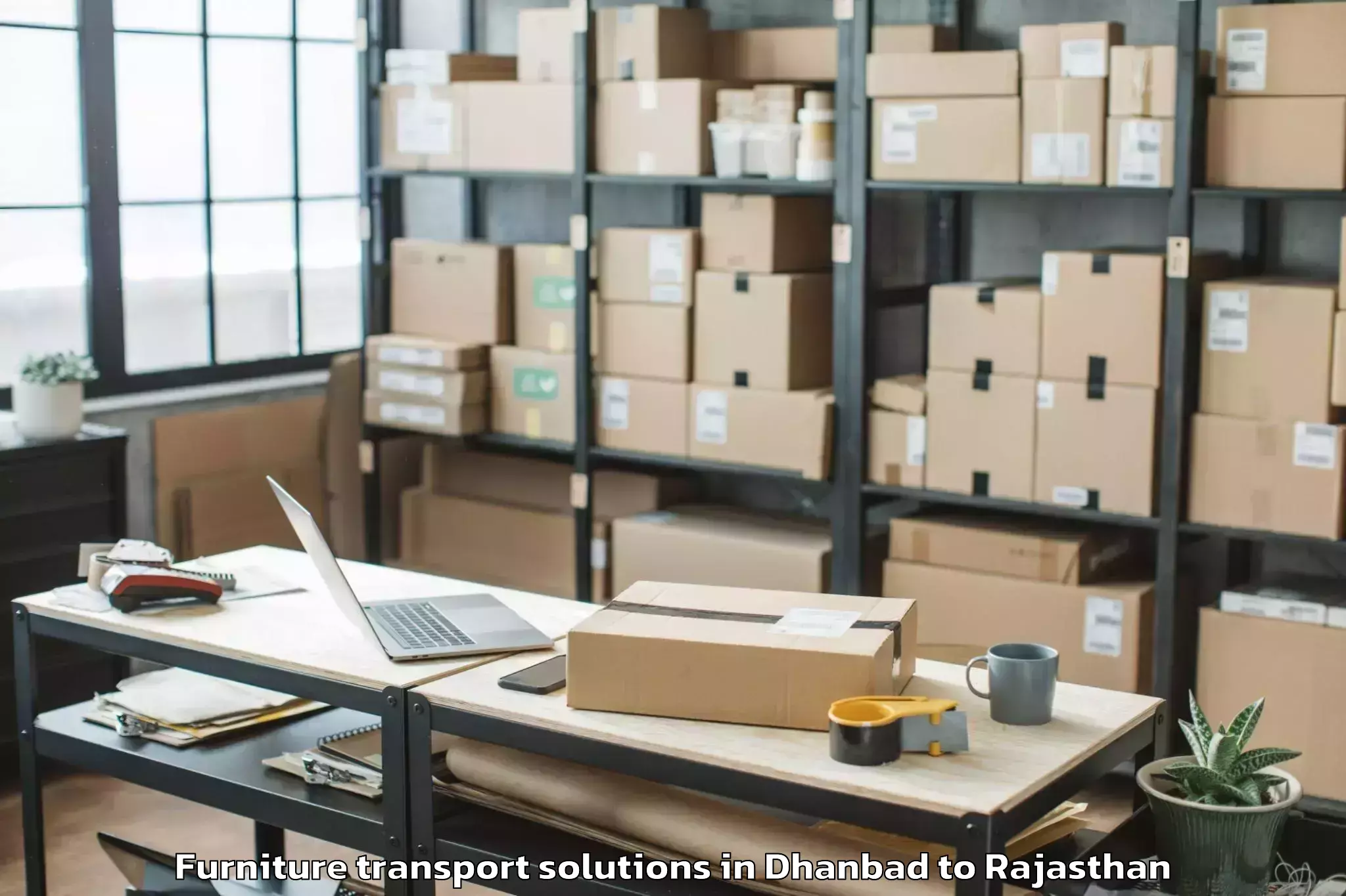 Book Your Dhanbad to Kapasan Furniture Transport Solutions Today